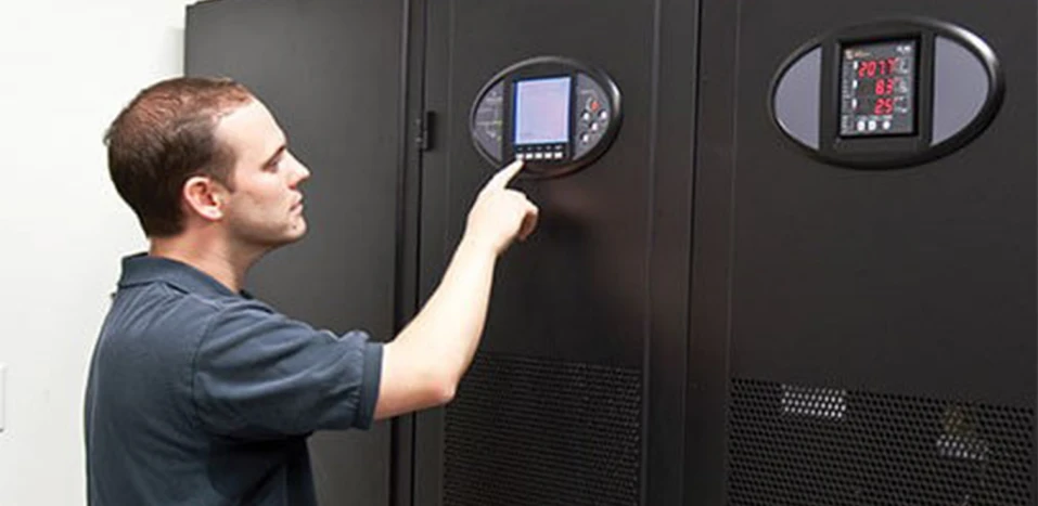 man performing ups system maintenance